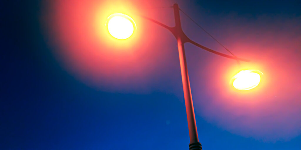 An image of a old fashioned streetlight with a deep blue background